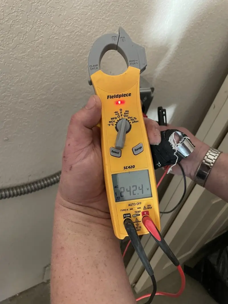 Voltage testing with clamp meter during Circuit Breaker Repair in Edmonds